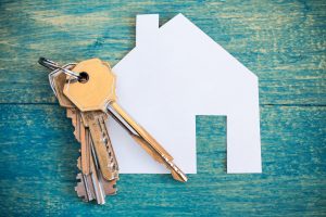 Carolina Home Spot House and keys on wooden background